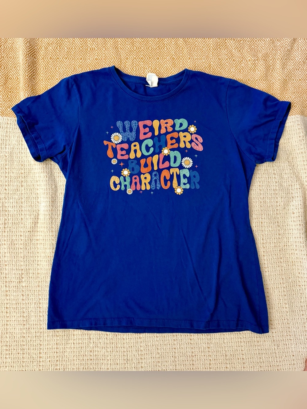 Blue T-Shirt with Colorful 'Weird Teachers Build Character' Graphic